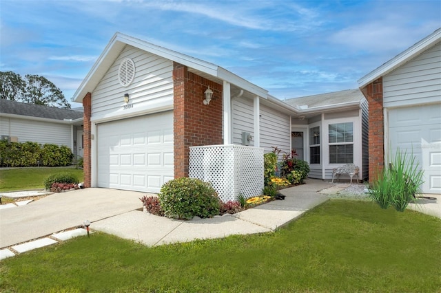 view of property exterior with an attached garage, brick siding, concrete driveway, and a yard