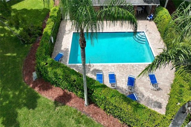 view of subject property featuring a pool area
