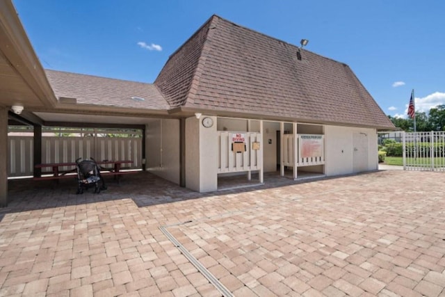 view of patio featuring fence