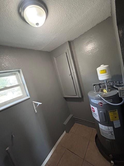 utility room featuring electric water heater