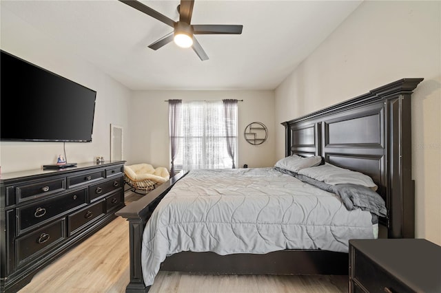bedroom with light wood-type flooring and ceiling fan