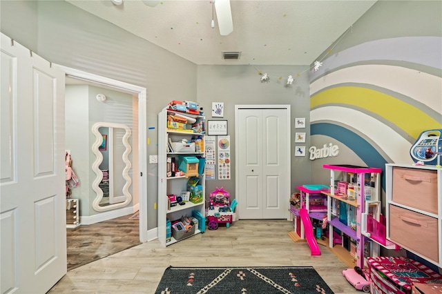 game room featuring wood finished floors and a ceiling fan