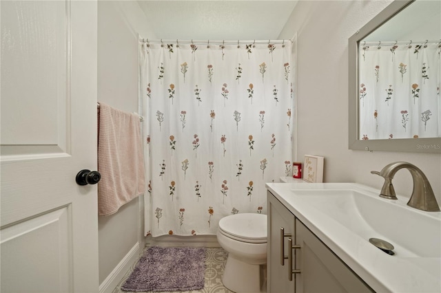 full bathroom with toilet, vanity, curtained shower, and tile patterned floors