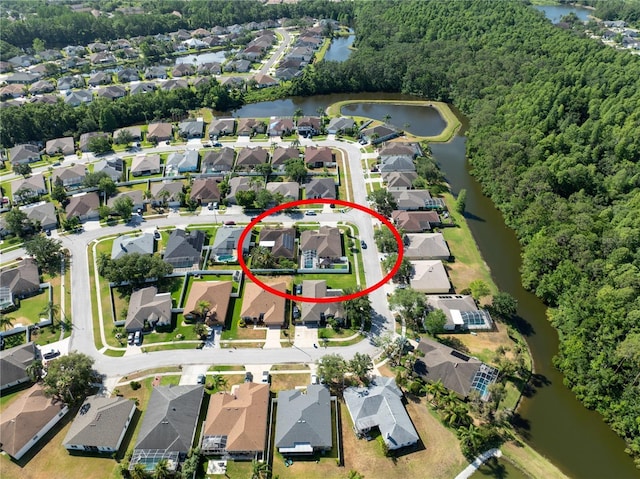 aerial overview of property's location featuring a nearby body of water and nearby suburban area