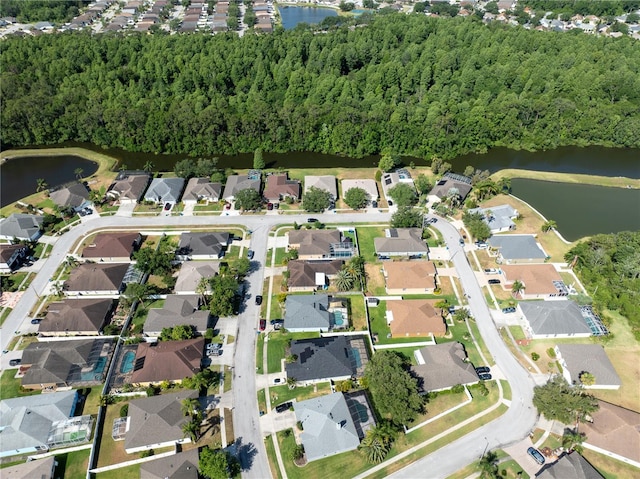aerial overview of property's location with nearby suburban area and a large body of water