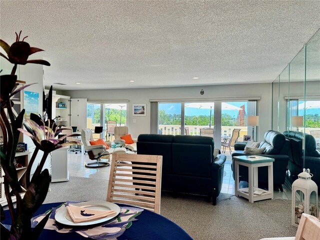 100 Bluff View Dr Unit 105C, Belleair Bluffs, FL 33770 - dining area with a textured ceiling