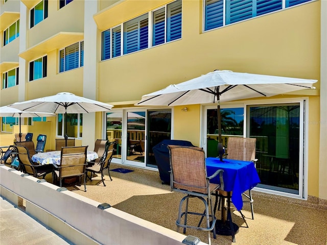 100 Bluff View Dr Unit 105C, Belleair Bluffs, FL 33770 - view of patio / terrace with outdoor dining space
