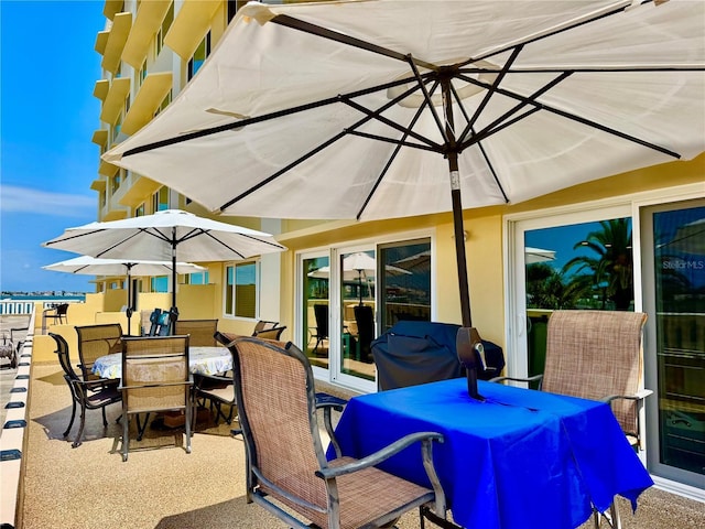 100 Bluff View Dr Unit 105C, Belleair Bluffs, FL 33770 - view of patio / terrace with outdoor dining space