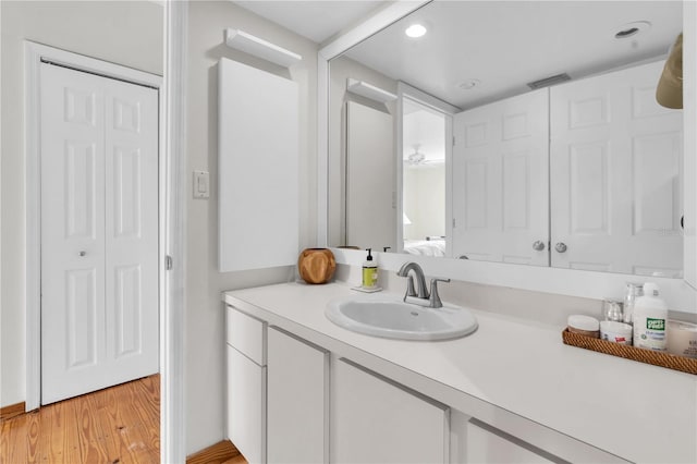 3200 Gulf Blvd Unit 202, St Pete Beach, FL 33706 - bathroom with a closet, wood finished floors, vanity, and recessed lighting