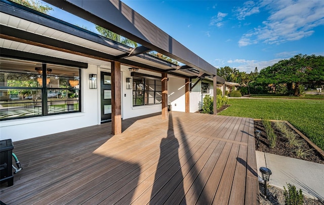 wooden deck with a lawn