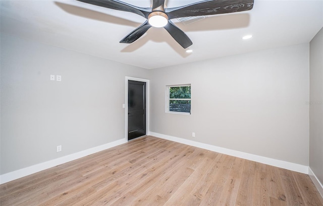 spare room featuring baseboards, wood finished floors, ceiling fan, and recessed lighting
