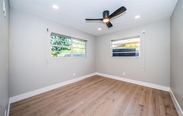 unfurnished room with light wood-type flooring, baseboards, ceiling fan, and recessed lighting