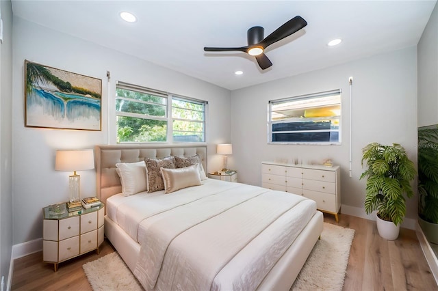 bedroom featuring light wood-type flooring, recessed lighting, baseboards, and a ceiling fan