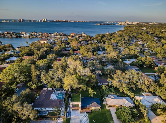 view of property location with a nearby body of water and nearby suburban area