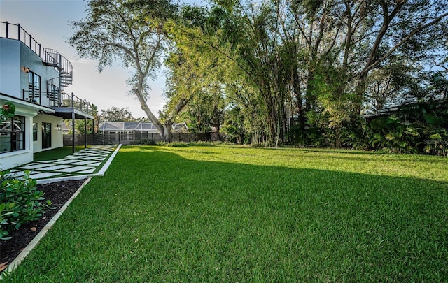 view of yard featuring a balcony