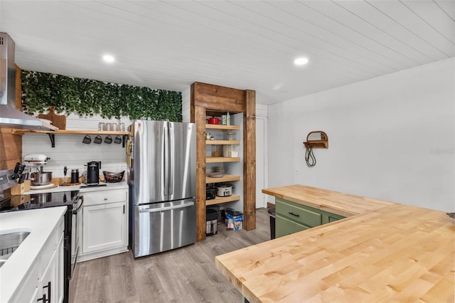 9821 113th St Unit 201, Seminole, FL 33772 - kitchen featuring freestanding refrigerator, electric range, open shelves, butcher block countertops, and wall chimney range hood
