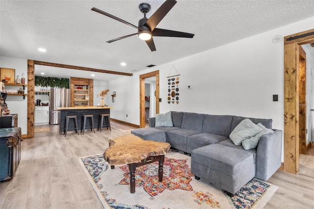 9821 113th St Unit 201, Seminole, FL 33772 - living area featuring a textured ceiling, a ceiling fan, light wood finished floors, recessed lighting, and baseboards