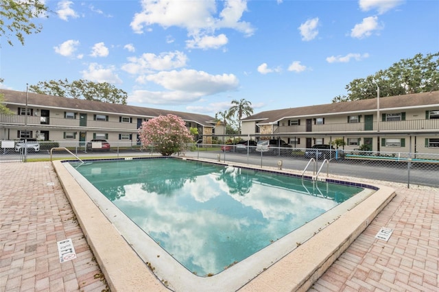 9821 113th St Unit 201, Seminole, FL 33772 - community pool with a residential view and fence
