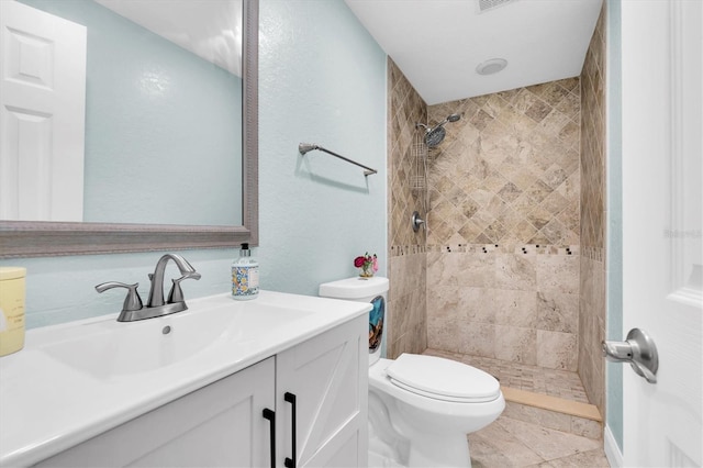 full bath with toilet, a shower stall, and vanity