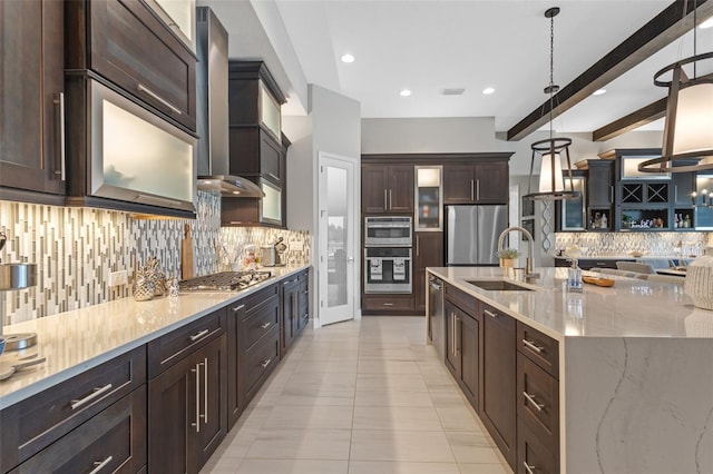 21642 Emory Oak Pl, Land O Lakes, FL 34637 - kitchen with a sink, stainless steel appliances, backsplash, wall chimney exhaust hood, and dark brown cabinetry