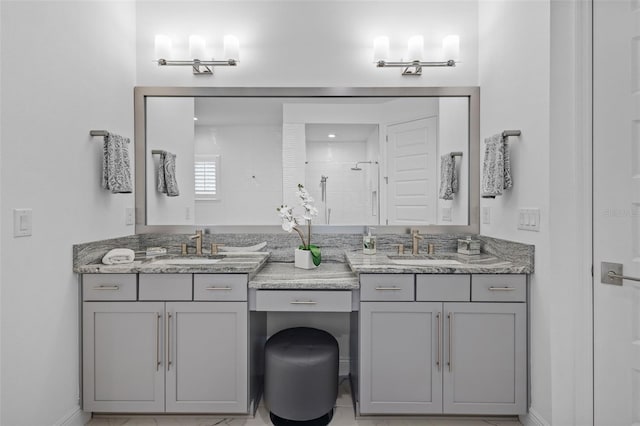 21642 Emory Oak Pl, Land O Lakes, FL 34637 - full bath with double vanity, tiled shower, and baseboards