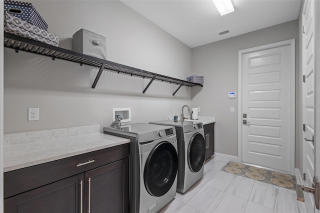 21642 Emory Oak Pl, Land O Lakes, FL 34637 - laundry room with cabinet space, washing machine and dryer, and baseboards