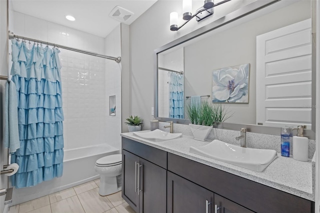 21642 Emory Oak Pl, Land O Lakes, FL 34637 - bathroom featuring double vanity, shower / bath combo with shower curtain, and toilet