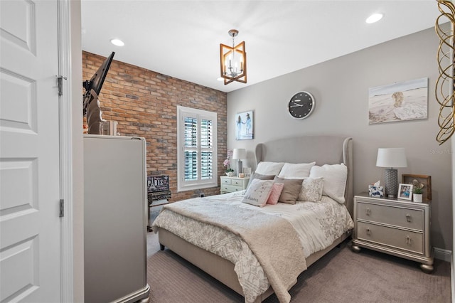 21642 Emory Oak Pl, Land O Lakes, FL 34637 - carpeted bedroom with brick wall, a chandelier, and recessed lighting