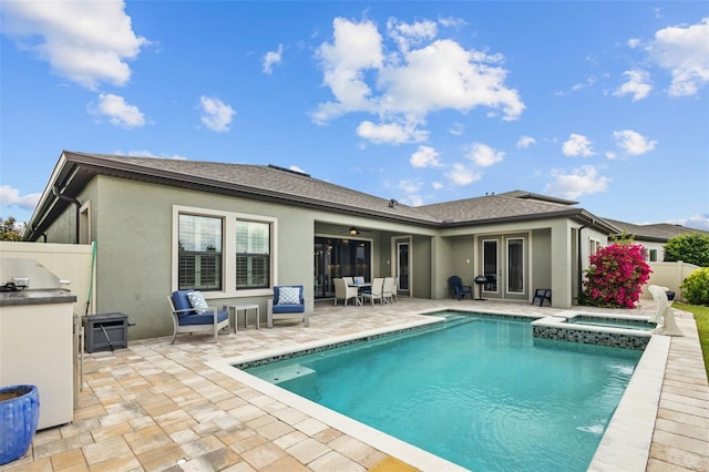21642 Emory Oak Pl, Land O Lakes, FL 34637 - back of house with a patio area, stucco siding, an outdoor kitchen, and a ceiling fan
