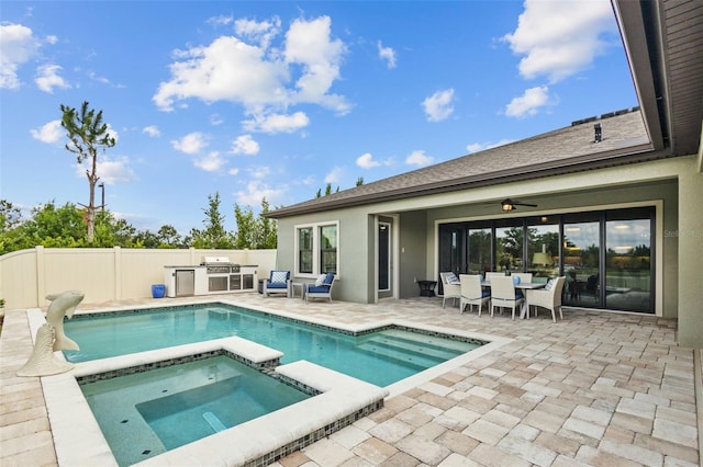 21642 Emory Oak Pl, Land O Lakes, FL 34637 - view of swimming pool featuring exterior kitchen, a patio area, outdoor dining area, a pool with connected hot tub, and a ceiling fan