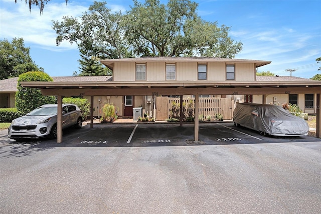 3203 Doe Ct, Brandon, FL 33511 - covered parking lot featuring fence