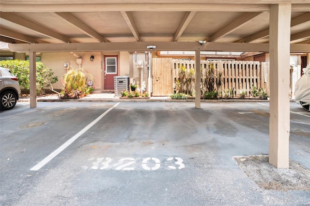 3203 Doe Ct, Brandon, FL 33511 - covered parking lot featuring fence