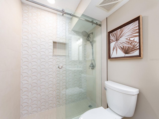 full bath featuring a walk in shower and toilet