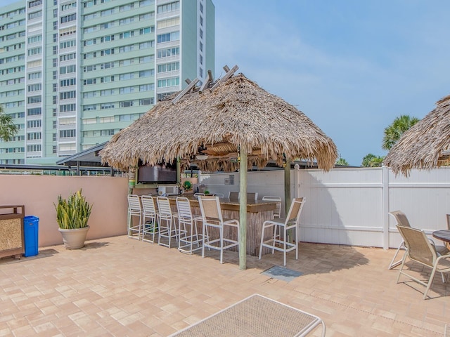 view of patio / terrace with fence and a gazebo