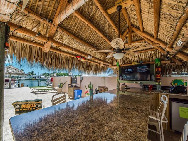 view of patio with ceiling fan and a gazebo