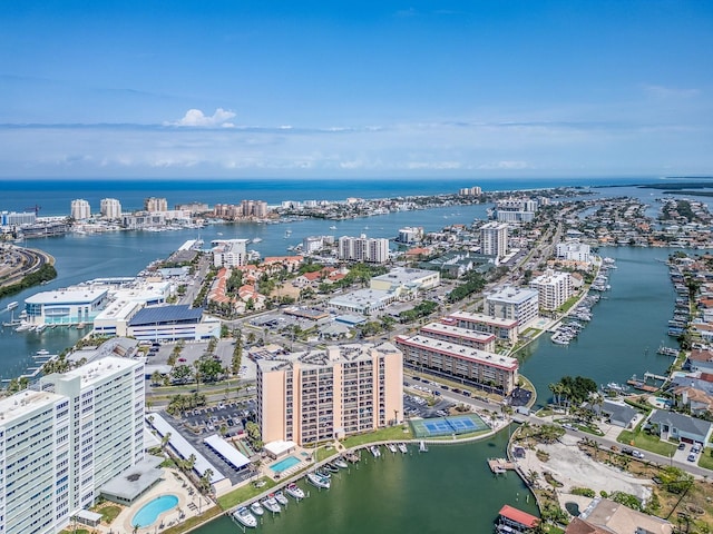 view of urban area featuring a large body of water and a marina