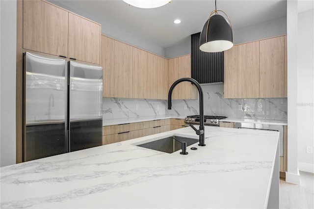 607 W Euclid Ave Unit 3, Tampa, FL 33602 - kitchen with appliances with stainless steel finishes, light brown cabinetry, modern cabinets, light stone counters, and recessed lighting