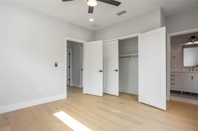607 W Euclid Ave Unit 3, Tampa, FL 33602 - unfurnished bedroom with light wood-style floors, a closet, baseboards, recessed lighting, and ensuite bathroom