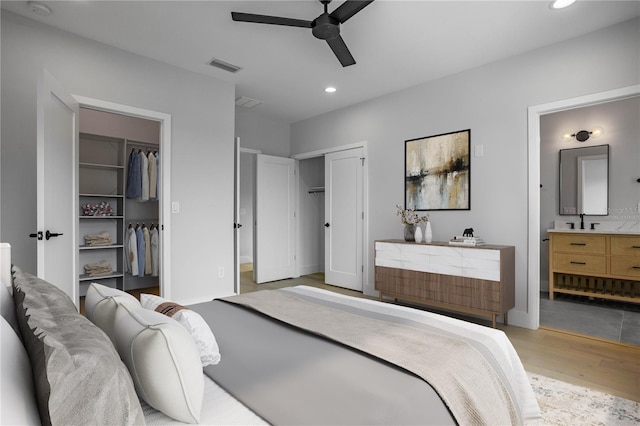 607 W Euclid Ave Unit 3, Tampa, FL 33602 - bedroom featuring light wood-style flooring, recessed lighting, two closets, ensuite bathroom, and ceiling fan