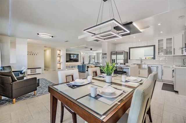 5744 150th Ave N, Clearwater, FL 33760 - dining space with light tile patterned floors
