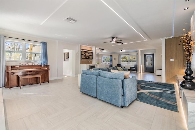 5744 150th Ave N, Clearwater, FL 33760 - living room featuring a ceiling fan and baseboards