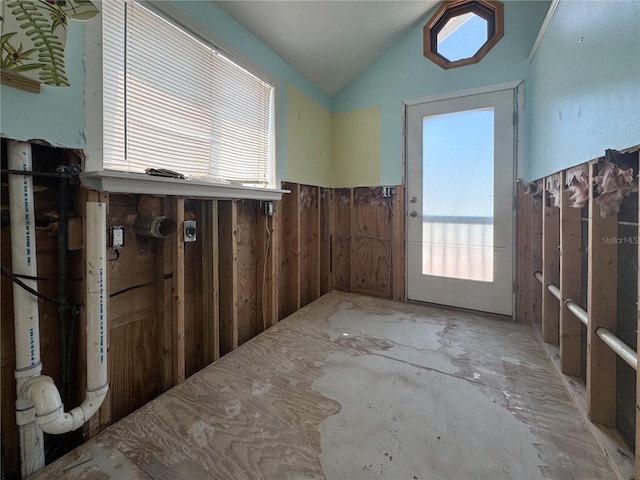 13326 1st St E, Madeira Beach, FL 33708 - empty room featuring wainscoting and vaulted ceiling