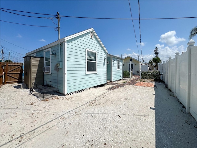 13326 1st St E, Madeira Beach, FL 33708 - rear view of property with a fenced backyard