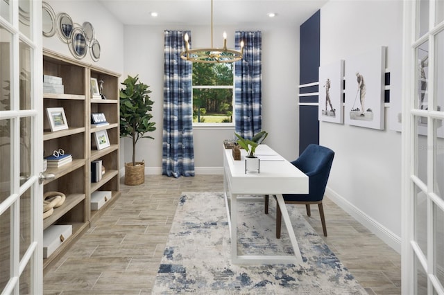 office space featuring baseboards, light wood-style flooring, recessed lighting, and french doors