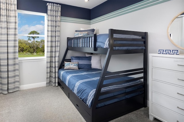 bedroom featuring carpet flooring and baseboards