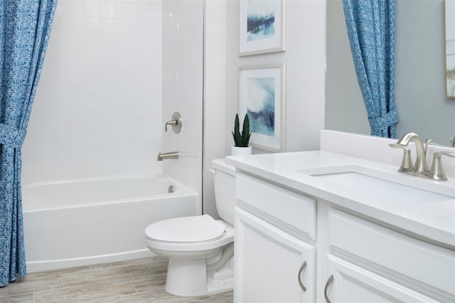 full bathroom featuring toilet, shower / bath combo, vanity, and wood finished floors