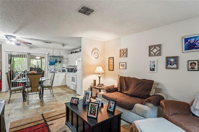 1250/1252/1254 Sylvia Ave, Spring Hill, FL 34606 - living room featuring ceiling fan and a textured ceiling