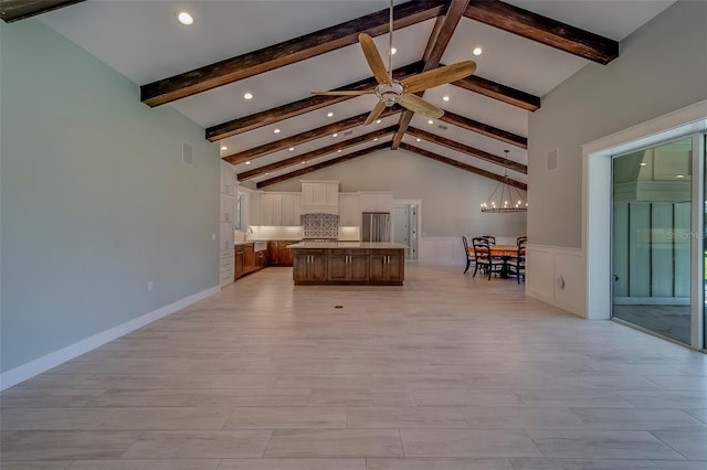 bedroom featuring freestanding refrigerator, recessed lighting, a wainscoted wall, light wood finished floors, and a sink