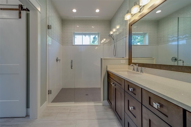 full bath featuring a stall shower, vanity, and recessed lighting