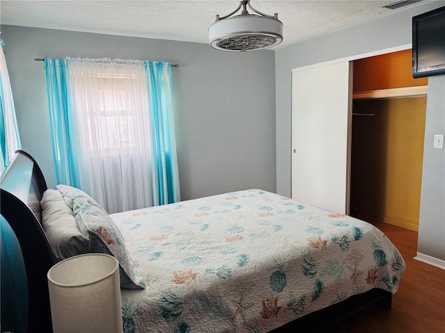 821 Karen St, Palm Harbor, FL 34684 - bedroom featuring wood finished floors, a closet, and baseboards